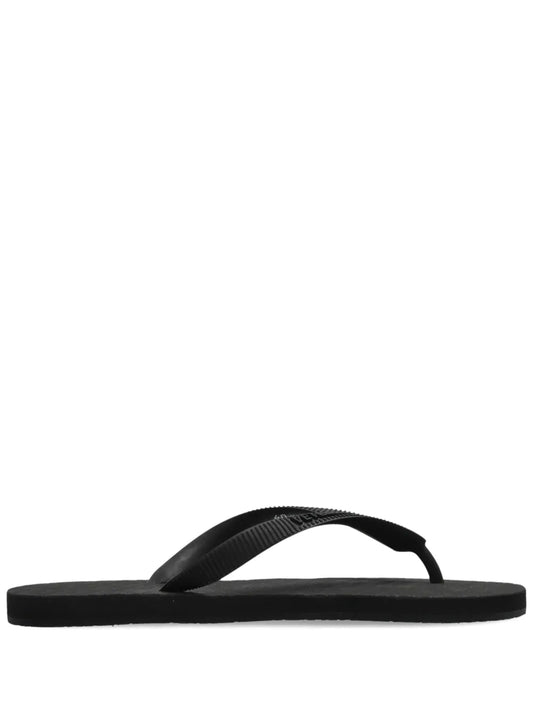 VETEMENTS embossed logo flip flops 